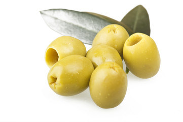 Pitted green olives close up on the white