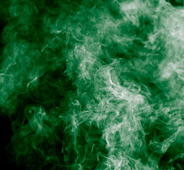 green smoke on a black background