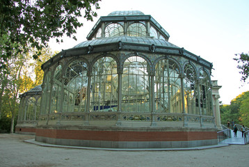 Fototapeta na wymiar MADRID, SPAIN - AUGUST 25, 2012: The Palacio de Cristal (Crystal Palace) in Buen Retiro Park (El Retiro), Madrid, Spain