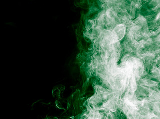 green smoke on a black background