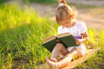 portrait of little girl outdoors in summer © zagorodnaya