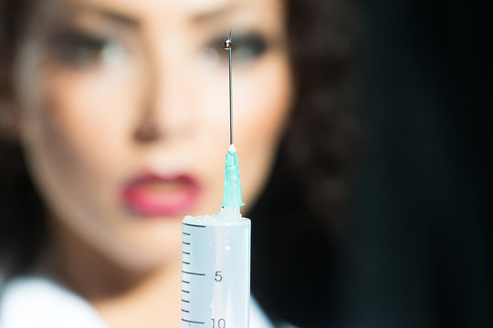 Nurse holding suringe