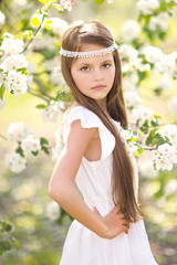 portrait of little girl outdoors in summer