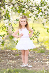 portrait of little girl outdoors in summer