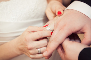 Bride and groom with wedding rings
