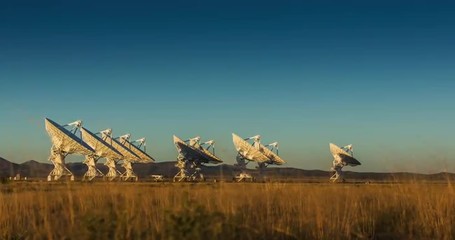 Satellite Array Time Lapse at Sunset. Camera moves right on a time lapse of a satellite array in New Mexico as the sunsets and the stars come out
