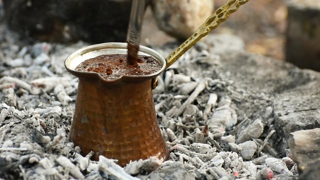 Turkish coffee cooking on embers