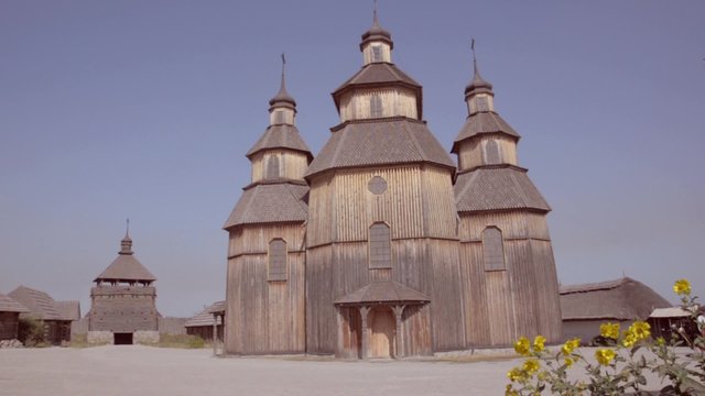 Church on the island Khortytsya and Kozak passes by. Zaporizhzhya Sich, Ukraine. 