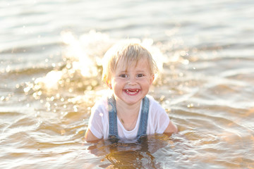 portrait of little girl outdoors in summer