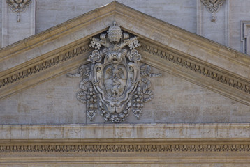 Close up detail of the pediment of Saint Peter Basilica in Rome