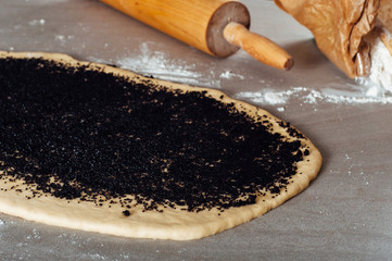 Man hands making poppy seed pastry