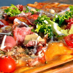 Pizza on wooden board