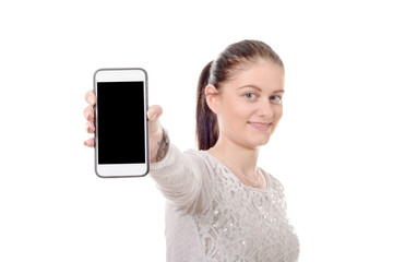 Happy young woman showing blank smartphone screen