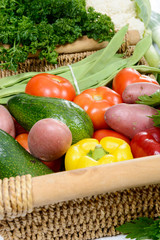  basket of seasonal vegetables on  wooden table