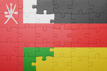 Fototapeta premium puzzle with the national flag of germany and oman