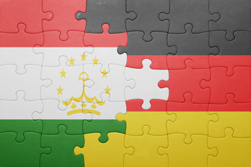 puzzle with the national flag of germany and tajikistan