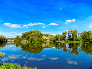 Fototapeta premium Lake with reflexion, trees and sky