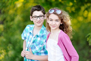 Portrait of a boy and girl  in summer