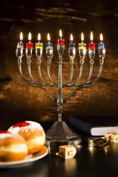 Jewish Holiday Hanukkah With Menorah, Torah, Donuts And Wooden D