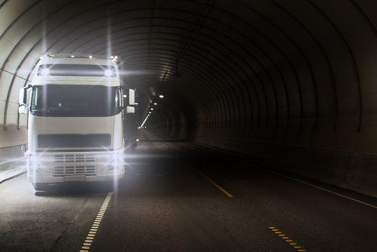 Truck in a long road tunnel