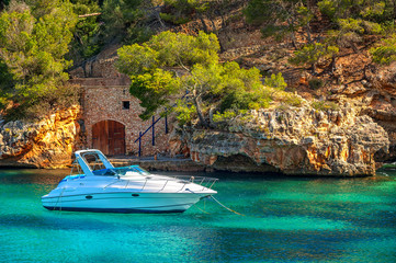 Beautiful white yacht in harbor of Cala Figuera, Mallorca, Spain
