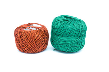 Orange and green cotton crochet. Isolated on white background.