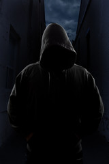 Hooded figure in alley