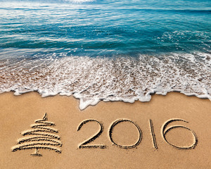 new year 2016 written in sand