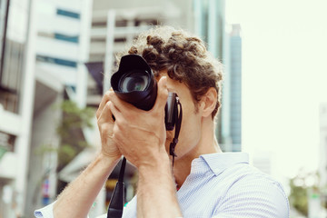 Male photographer taking picture