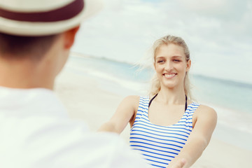 Happy couple having fun on the beach.