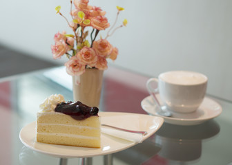 Blueberry cake with cup of coffee
