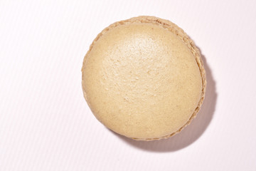 French macaron yellow on a pink background