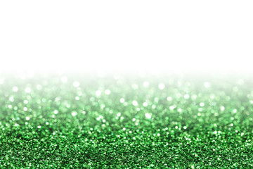 Green sparkle. Glitter background. Holiday blurred background.