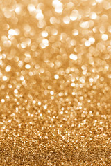 Golden sparkle. Glitter background. Holiday blurred background.