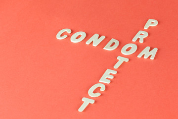 Fototapeta na wymiar Condom and Protect Puzzle on Red Blood Background