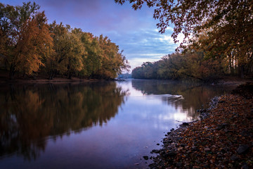 Peaceful and Serene River with Sky Reflections. Natural Beauty Background with Gorgeous Copy Space.