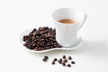 Cup of coffee and fresh roasted organic Coffee beans on isolated background, food and drink background