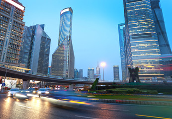 Fototapeta na wymiar light trails on the modern building background in shanghai china