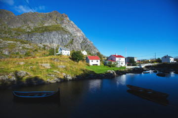 Fototapeta na wymiar Beautiful super wide-angle summer aerial view of Reine, Norway, Lofoten Islands, with skyline, mountains, famous fishing village with red fishing cabins, Moskenesoya, Nordland