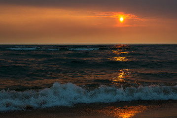 Fototapeta premium sunset on the lake through the haze