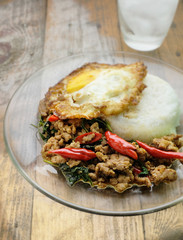 rice topped with stir-fried pork, basil and fried egg