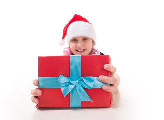 Teen girl with a gift in Santa hat