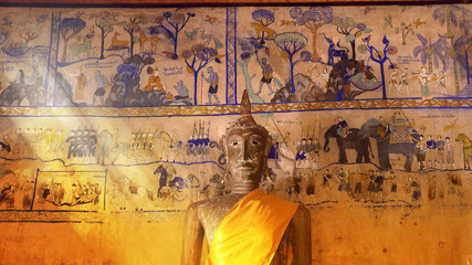 Buddha statue and ancient paint wall thai style inside of church © huawoon