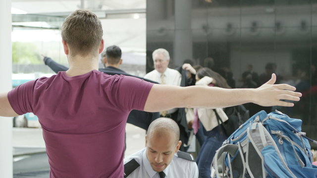  Airport Security Guards On Duty, Searching Passengers Before A Flight