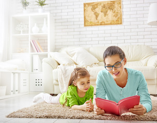 mother reading to daughter