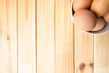 hen eggs on wood background