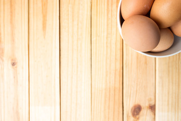 hen eggs on wood background