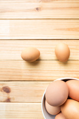 hen eggs on wood background