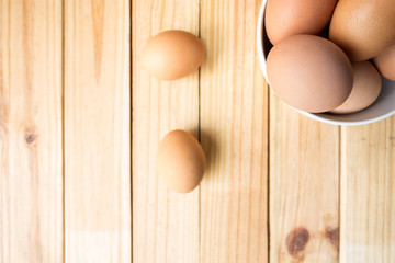 hen eggs on wood background