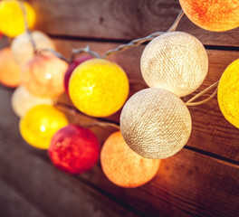Cotton Christmas garland. Bright multi-colored decoration.